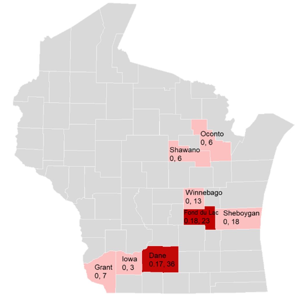 Map of Wisconsin counties showing alfalfa weevil counts with darker red areas in Dane and Fond du Lac counties indicating higher infestation levels, and lighter pink areas in Grant, Iowa, Winnebago, Sheboygan, Shawano, and Oconto counties showing lower counts.