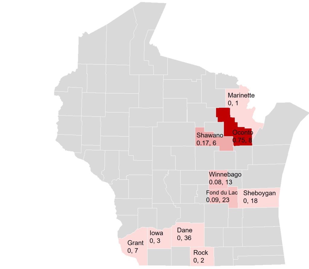 The map shows slug distribution across Wisconsin counties. One county (Oconto) in red has high presence (0.75 slugs/trap, 8 traps). Pink counties show lower counts. Gray counties have no data.